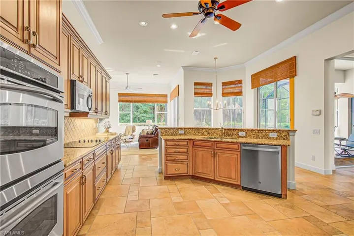 Kitchen with island overlooking family room