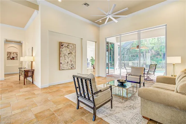 Living room with walk out to the pool.