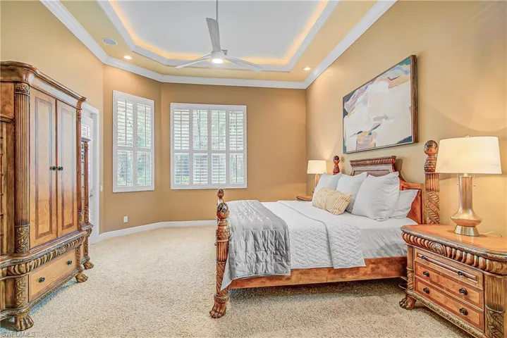 Spacious main bedroom with door to pool