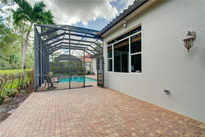 Unscreened area with access to bathroom.  Great for another sitting area- fire pit or outdoor kitchen
