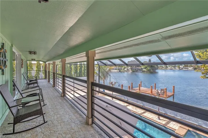 View of patio / terrace featuring a water view and a dock