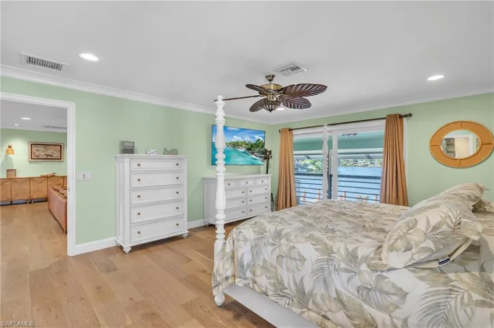 Bedroom featuring access to outside, recessed lighting, light wood-style floors, crown molding, and a ceiling fan