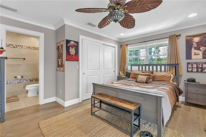Bedroom featuring ornamental molding, a closet, a ceiling fan, light wood finished floors, and recessed lighting