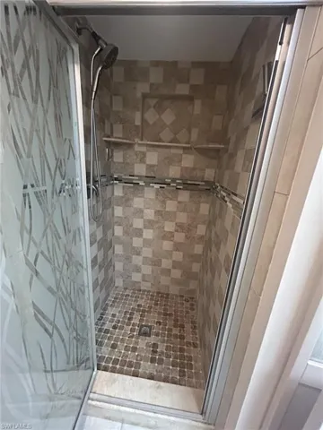 Primary bathroom remodeled shower With decorative Listello border