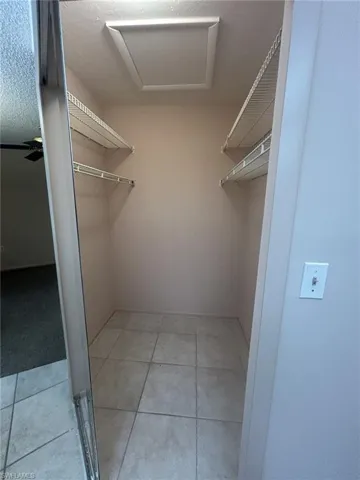 Primary bedroom walk in closet