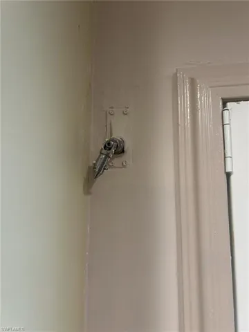 Attachment to maneuver hurricane shutters from inside