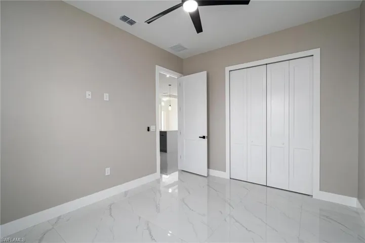 Bedroom featuring a closet and ceiling fan