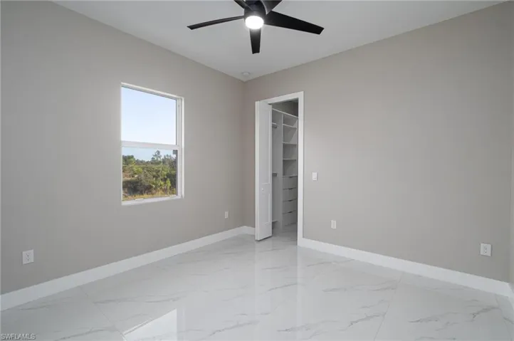 Spare room with ceiling fan