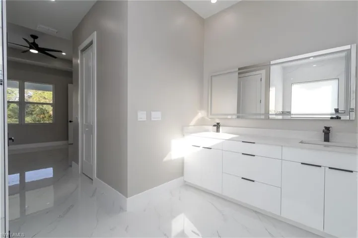 Bathroom featuring vanity and ceiling fan