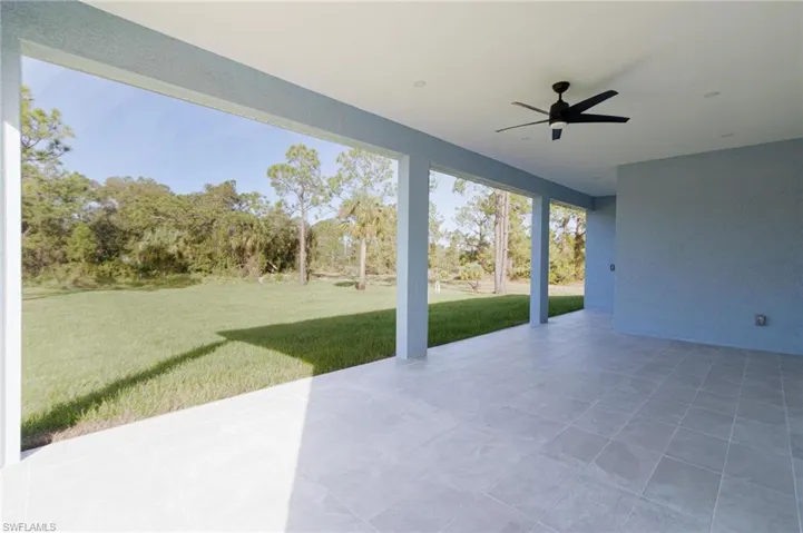 View of patio featuring ceiling fan