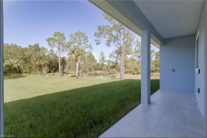 View of yard with a patio area