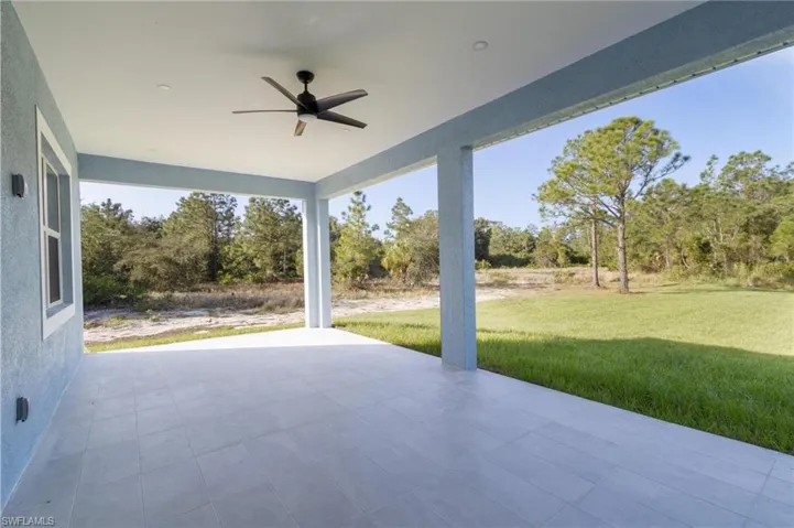 View of patio featuring ceiling fan