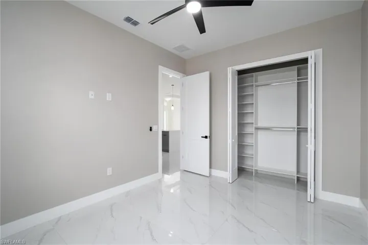 Bedroom featuring a closet and ceiling fan
