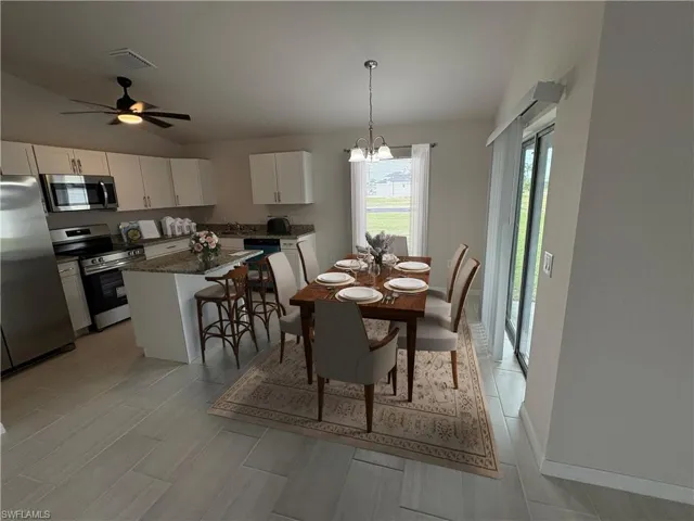 Dining room with ceiling fan with  notable chandelier.. ( Virtual Staged )