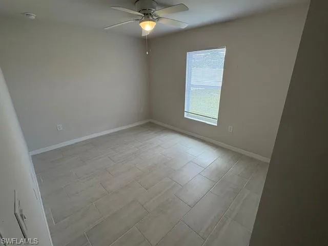 Unfurnished room with ceiling fan