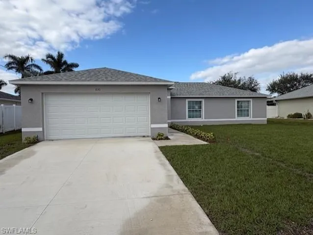 Ranch-style house featuring a front lawn
