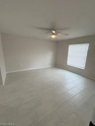 Spare room featuring ceiling fan