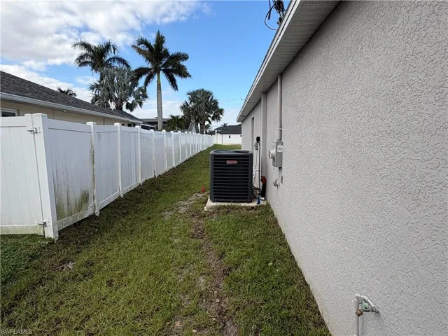 View of yard with cooling unit
