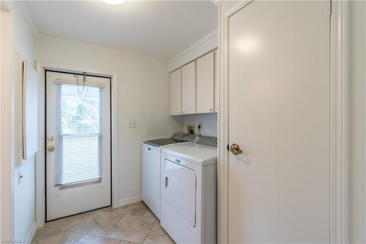 Laundry rm w/pool door and entry to Bath 2