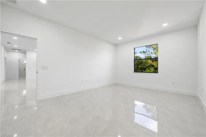 Unfurnished room featuring light tile flooring