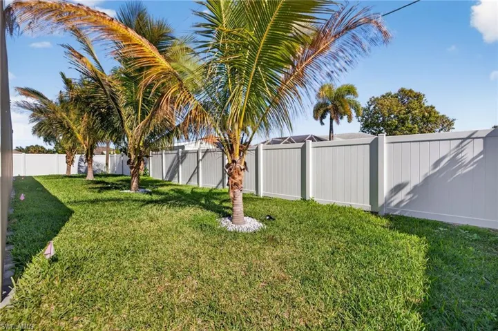 View of fenced backyard