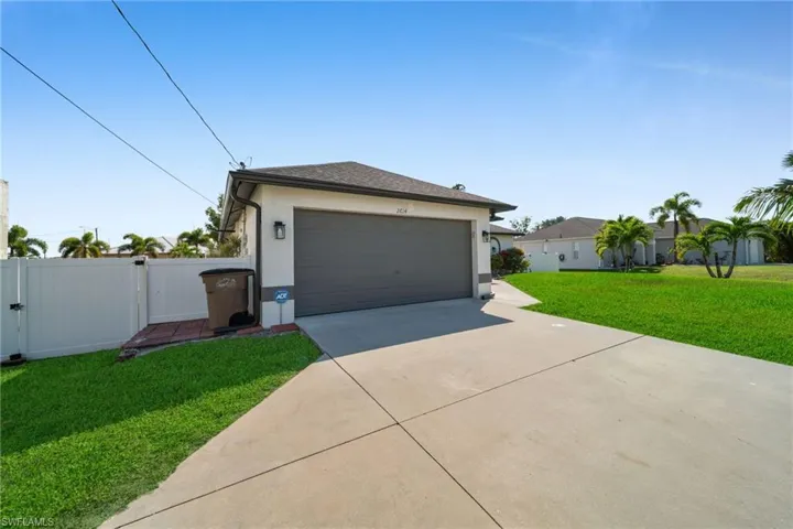 Garage with a gate and driveway