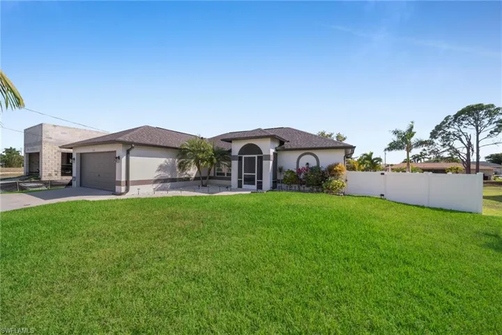 Mediterranean / spanish home featuring stucco siding, concrete driveway, and an attached garage