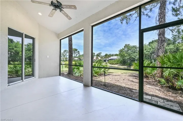 Screened lanai with water view.