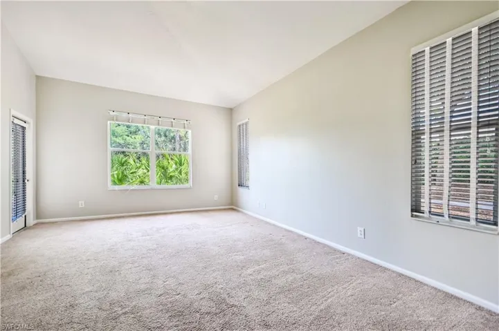 Primary bedroom with access to screened lanai.