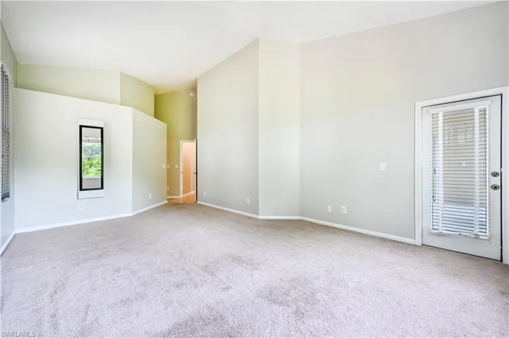 Primary bedroom with access to screened lanai.