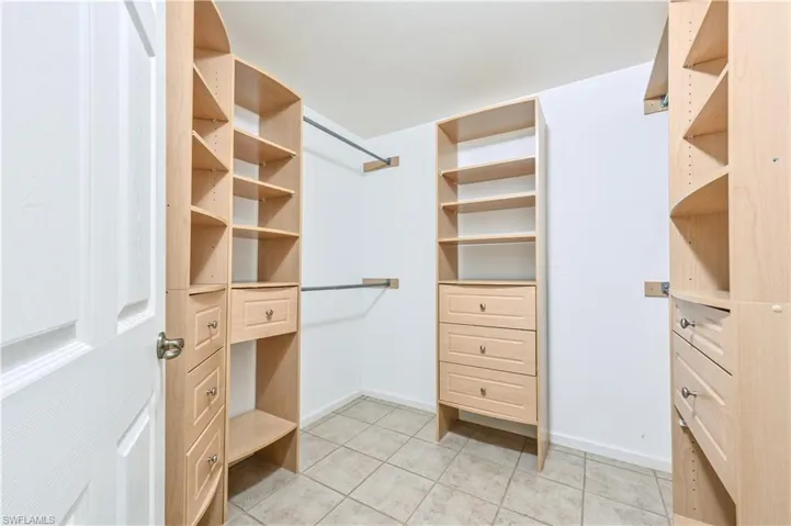 One of two primary walk-in closet spaces.