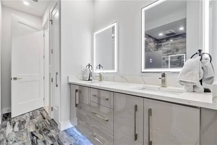 Custom anti-fog mirrors and toe kick  lighting under all cabinets