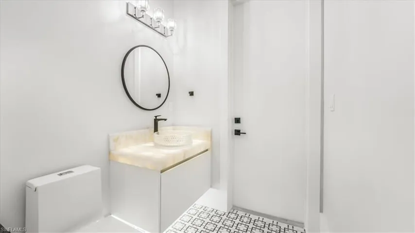 Bathroom featuring vanity and toilet