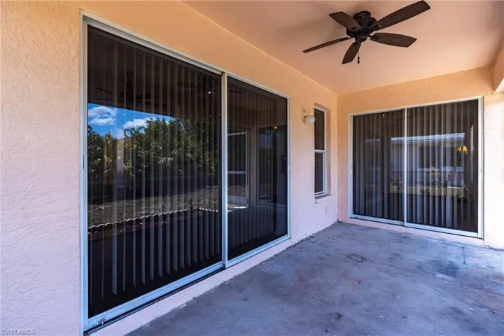 View of patio featuring ceiling fan