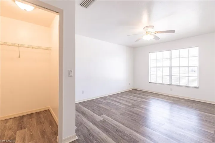 Unfurnished bedroom featuring light wood-style floors and a ceiling fan
