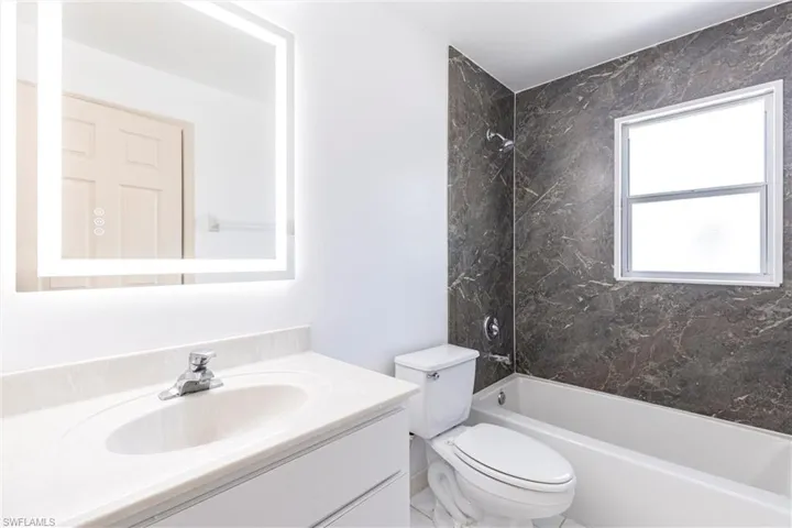 Full bathroom featuring  shower combination and vanity
