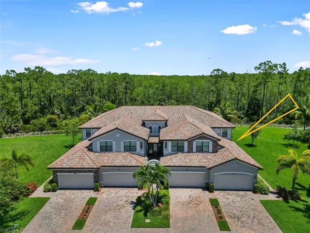 Mediterranean / spanish-style home with a front yard