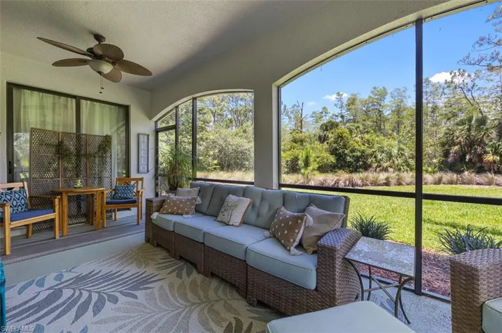 Sunroom featuring ceiling fan