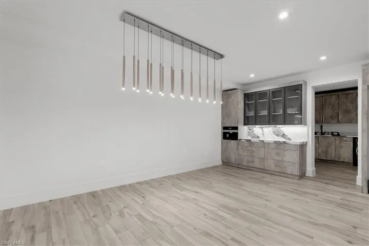 Unfurnished bedroom featuring light wood-style floors and recessed lighting
