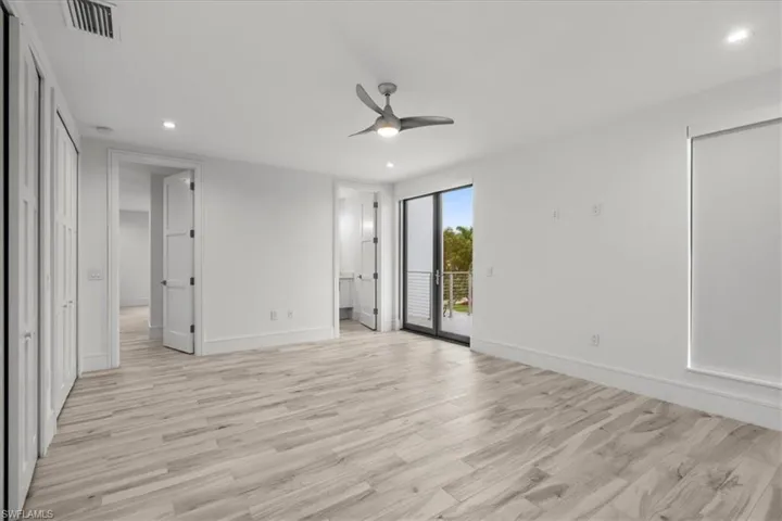Unfurnished bedroom with recessed lighting, light wood-style flooring, access to outside, and a ceiling fan