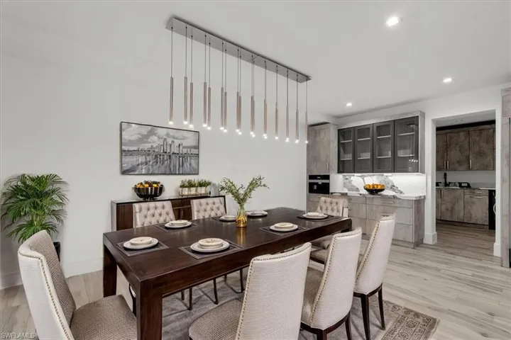 Dining space featuring light wood finished floors and recessed lighting