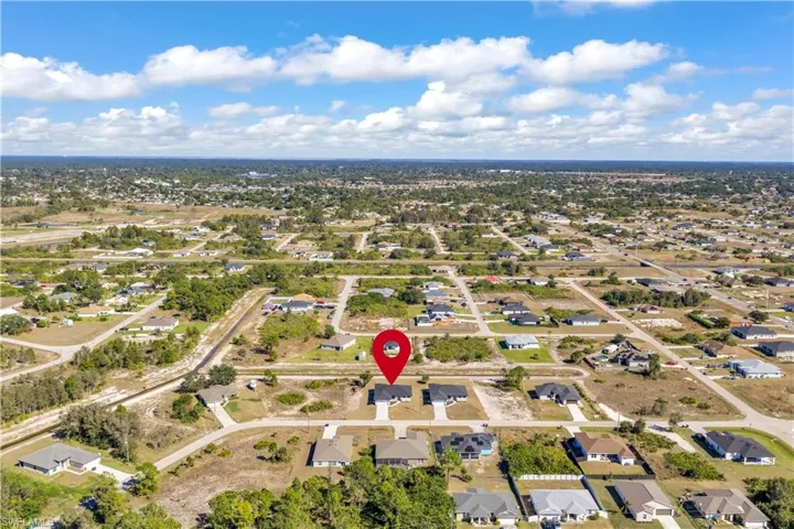 View of property location with nearby suburban area
