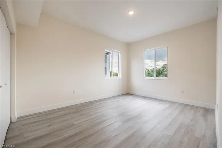 Spare room with recessed lighting, baseboards, and light wood-style flooring