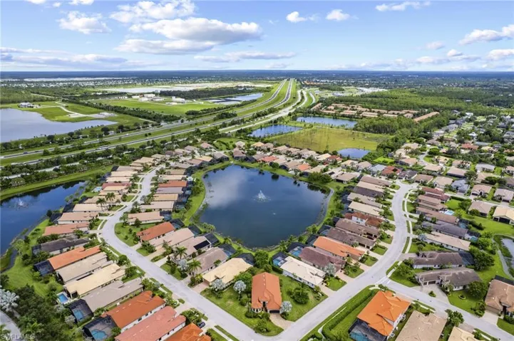 Aerial overview of property's location with nearby suburban area and a large body of water