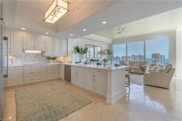 Kitchen with marble counters and backsplash