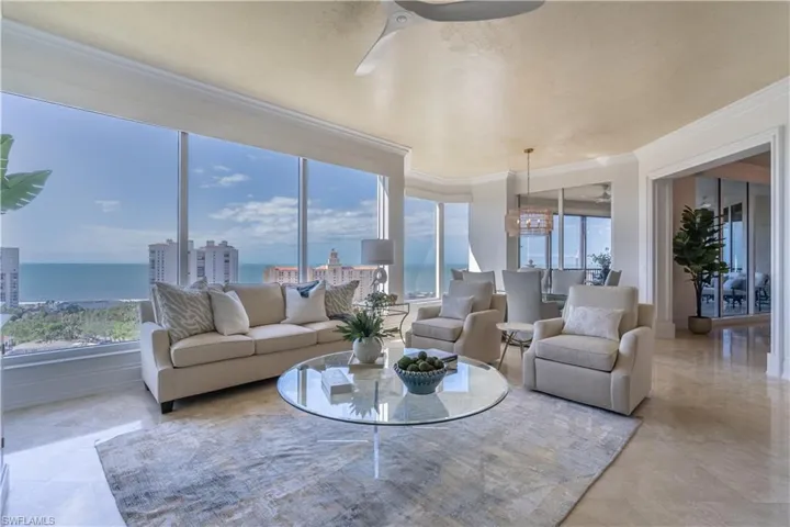 Family room with wall of windows overlooking the Gulf