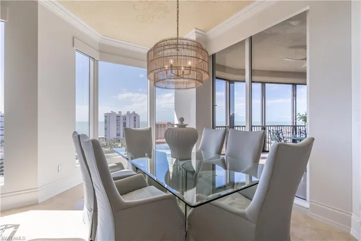 Grand salon with wall of sliders opening onto lanai