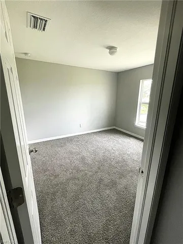 Guest Bedroom (1 of 2) with new carpet.