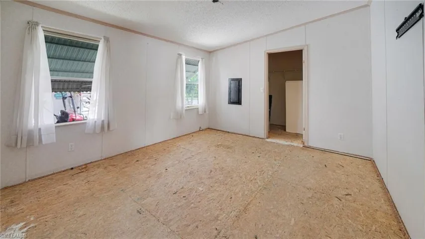 Spare room featuring a textured ceiling
