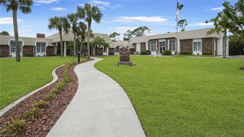 View of home's community with a lawn